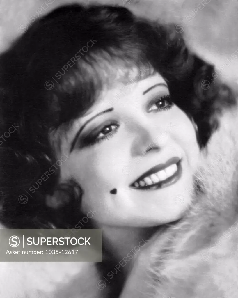 Hollywood, California:  1926  A photograph of a smiling Clara Bow, 'The It Girl'.