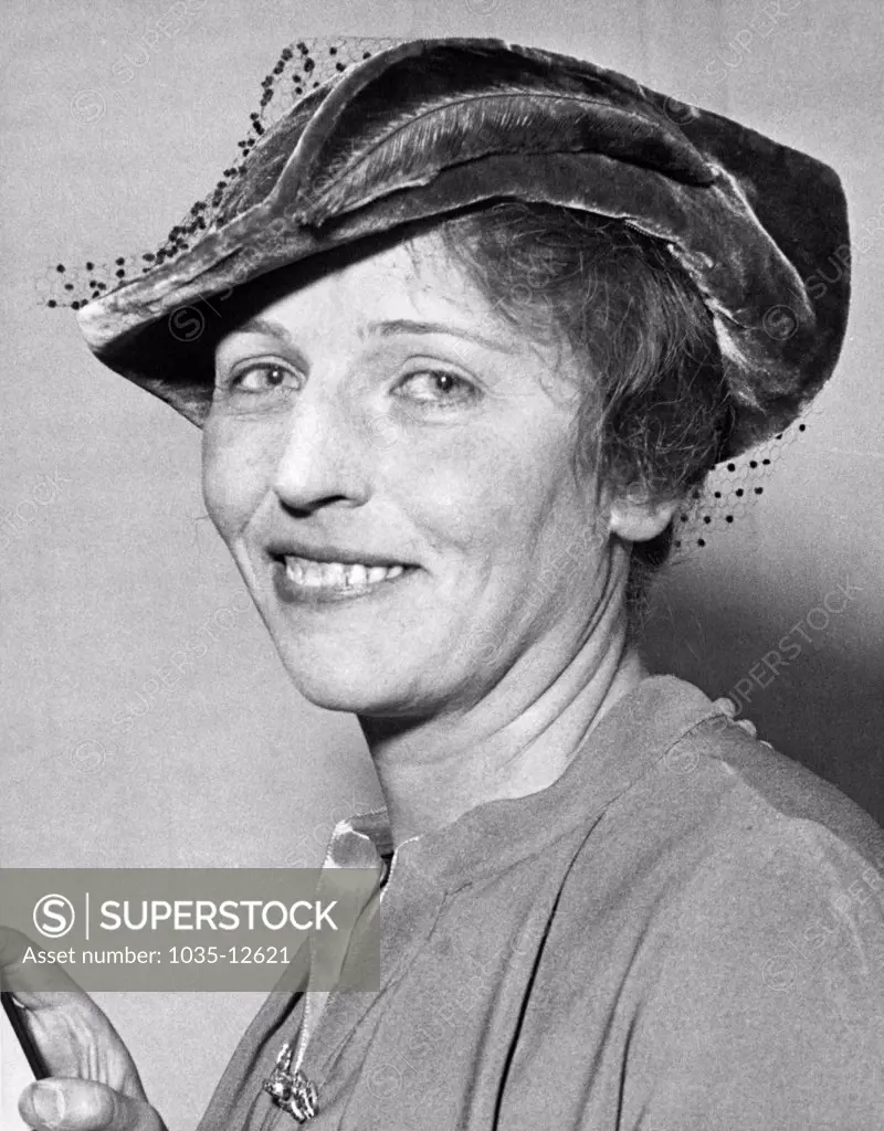 New York, New York:  November 10, 1938 Novelist Pearl Buck smiles as she is notified that she is the winner of the Literary Nobel Prize.