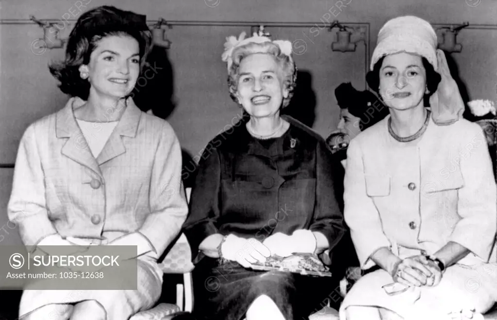 Washington, D.C.   May, 1962. Mrs. Jacqueline Kennedy, Mrs. Wallace Bennett of Utah, and Lady Bird johnson at a congressional wives luncheon.