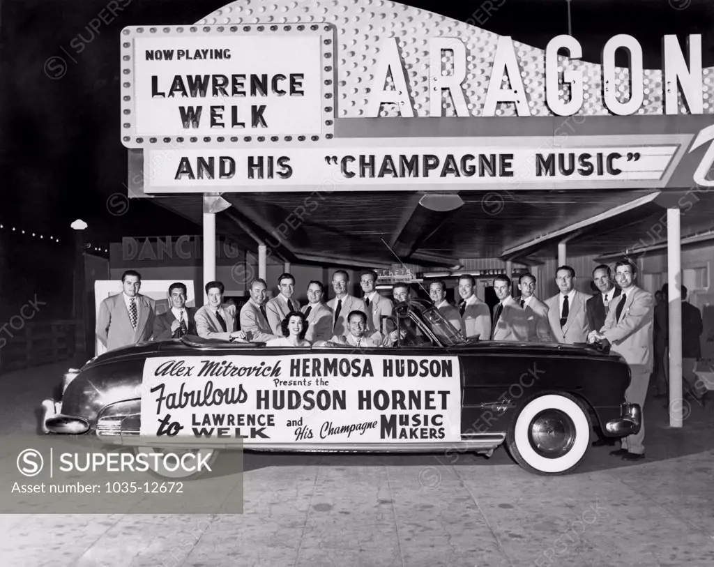 Santa Monica, California:  1951. Lawrence Welk and his new Hudson Hornet, at the Aragon Ballroom on Lick Pier in Santa Monica, which was the home of his new weekly televised TV show, 'The Lawrence Welk Show'.