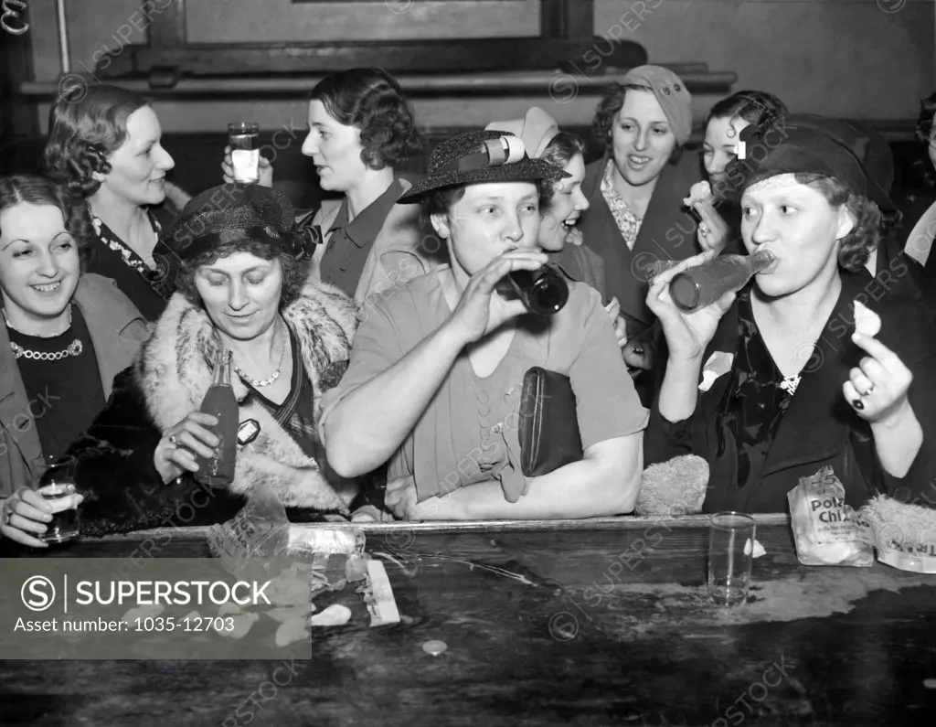 Peoria, Illinois:  April 9, 1937 Wives of Caterpillar Tractor Company employees celebrate after the company and C.I.O. leaders resolved the ongoing strike.