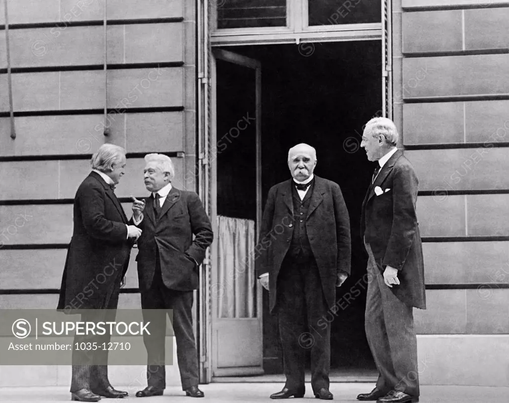 Paris, France:  1919 The Big Four at the Versailles Peace Conference. L-R are: Prime Minister Lloyd George of Great Britain, Prime Minister Vittorio Orlando of Italy, Premier Georges Clemenceau of France, and President Woodrow Wilson of the United States. They are  meeting at the Hotel Crillon in Paris.