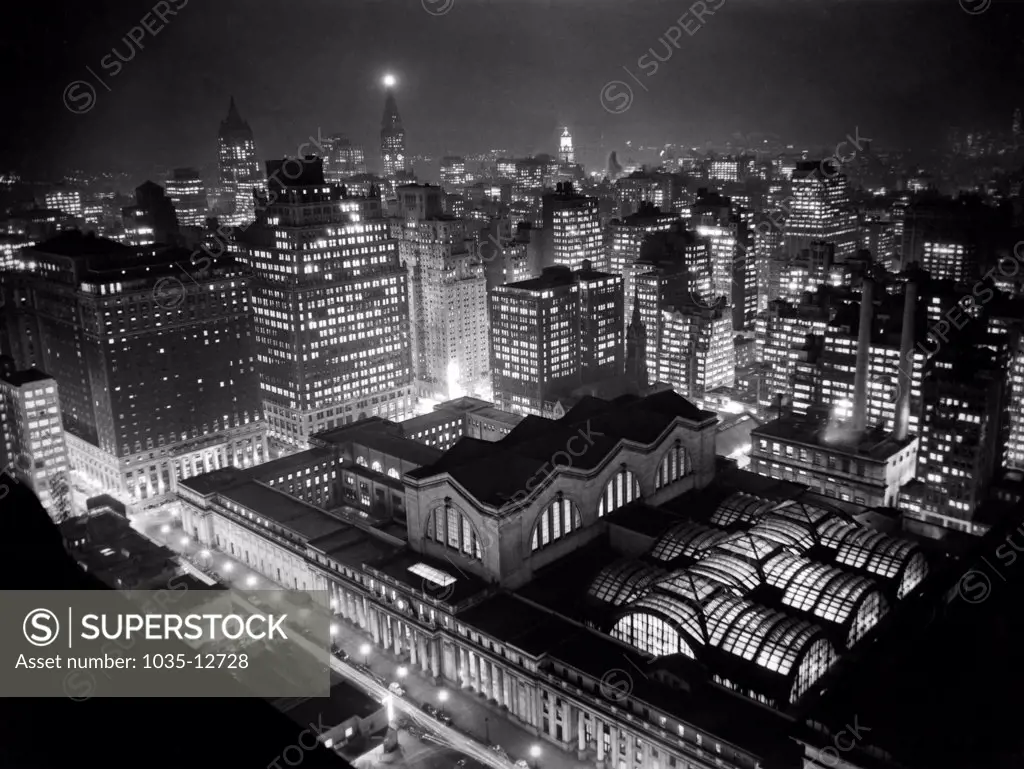 New York, New York:  c. 1940 New York's famed Penn Station as seen from the roof of the Hotel New Yorker. Right in the middle of Manhattan, Penn Station has welcomed millions of travelers to this thrilling metropolis.