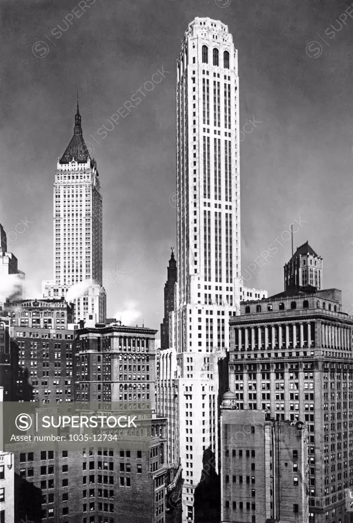 New York, New York:  c. 1932 The City Bank Farmers Trust Building in the center. It was the world's fourth tallest building when it was built in 1931 at 20 Exchange Place. It houses the world's largest private telephone exchange center.