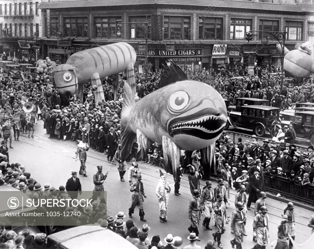New York, New York:   c. 1929 Part of the Thanksgiving Day Parade that officially brings Santa Claus into the Metropolis. The Fish Balloon is 35 feet long, while the Tiger Balloon is 60 feet long, and will be released as the parade nears its end on Broadway. They are filled with helium and will drift for a week, with a $100 prize awarded for each one recovered.
