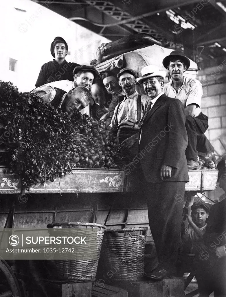 New York, New York:    c. 1910 One of the vegetable stands in the Public Market under the Manhattan Bridge.