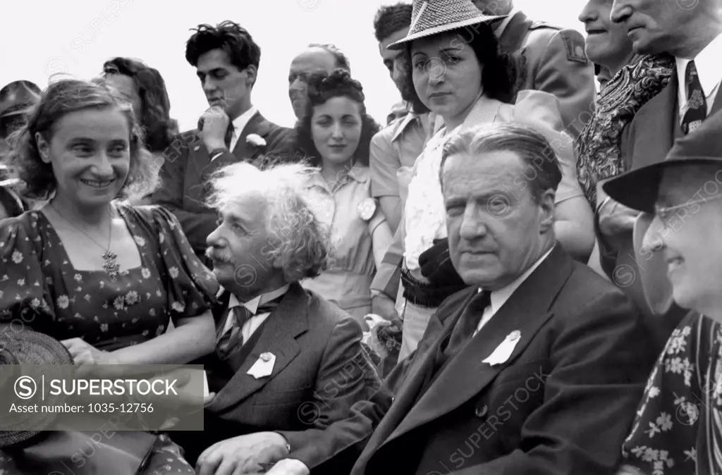 New York, New York:  1939 Albert Einstein with his daughter on his lap at the opening of the Jewish Pavillion at the World's Fair in Flushing Meadows in Queens. Grover Whalen is at his left.