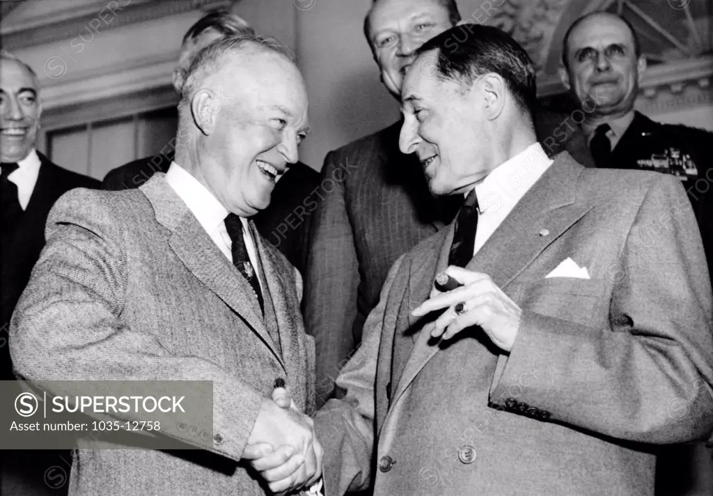 Washington, D.C.:  March 18, 1954 President Dwight D. Eisenhower and Gen. Douglas MacArthur shake hands after having had lunch together at the White House.