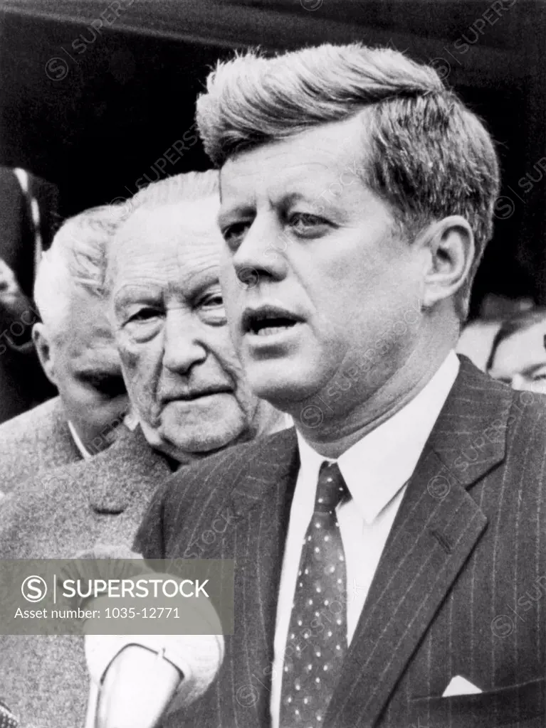 Washington, D.C.:  April 13, 1961 President Kennedy with West German Chancellor Konrad Adenauer declares that they have renewed their pledge to 'preserve the freedom of the people of West Berlin'.