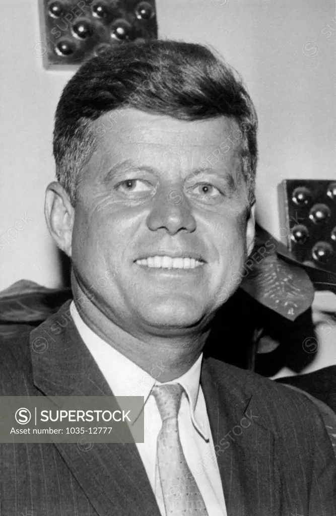 United States: c. 1960  A head and shoulders portrait shot of a smiling  John F. Kennedy.