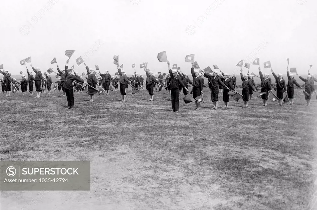Cape May, New Jersey: May 9, 1916 Naval reservemen learning semaphore signalling at the Naval Training Station