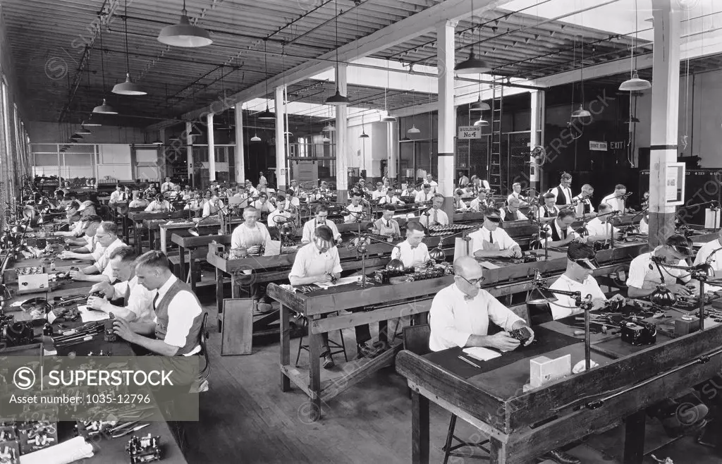 Rochester, New York:  c. 1923 Workers assembling Cine-Kodaks at the Camera Works at the Eastman Kodak Company. It was the first 16mm camera.