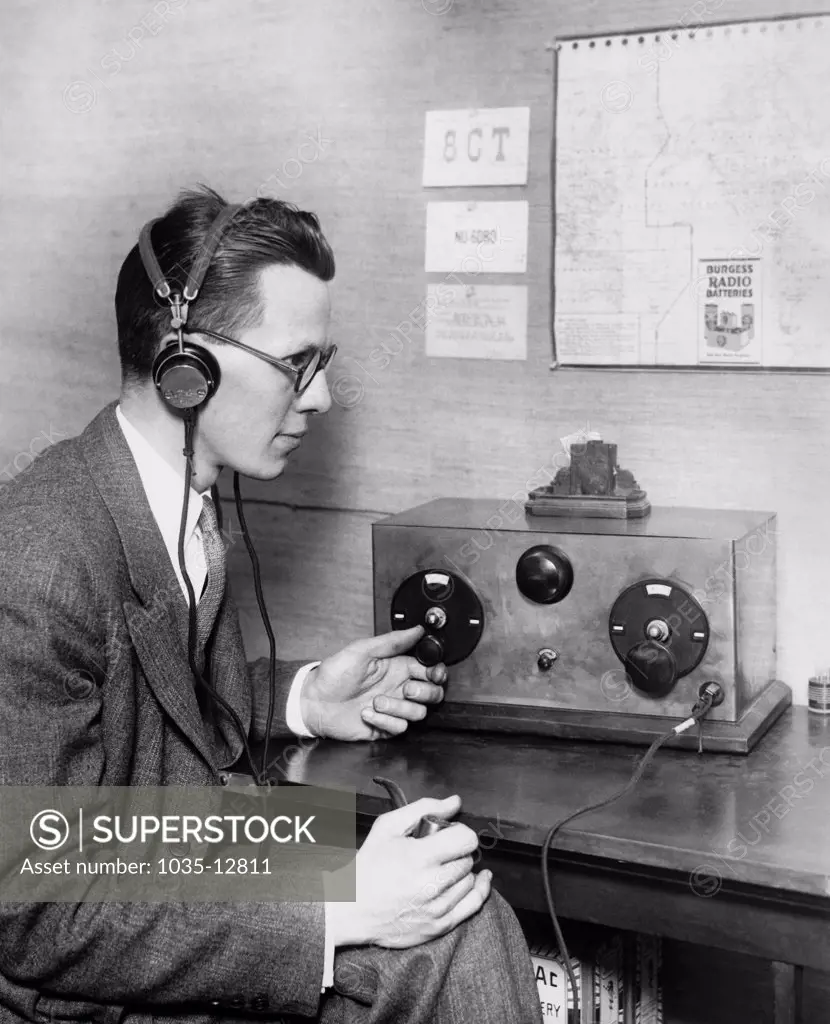 Upper Montclair, New Jersey:  c. 1929 This amateur radio operator has been able to communicate on the ten meter band coast to coast. The ten meter frequency had been consdiered of no value in the past. Here is Charles Atwater with his receiving set.