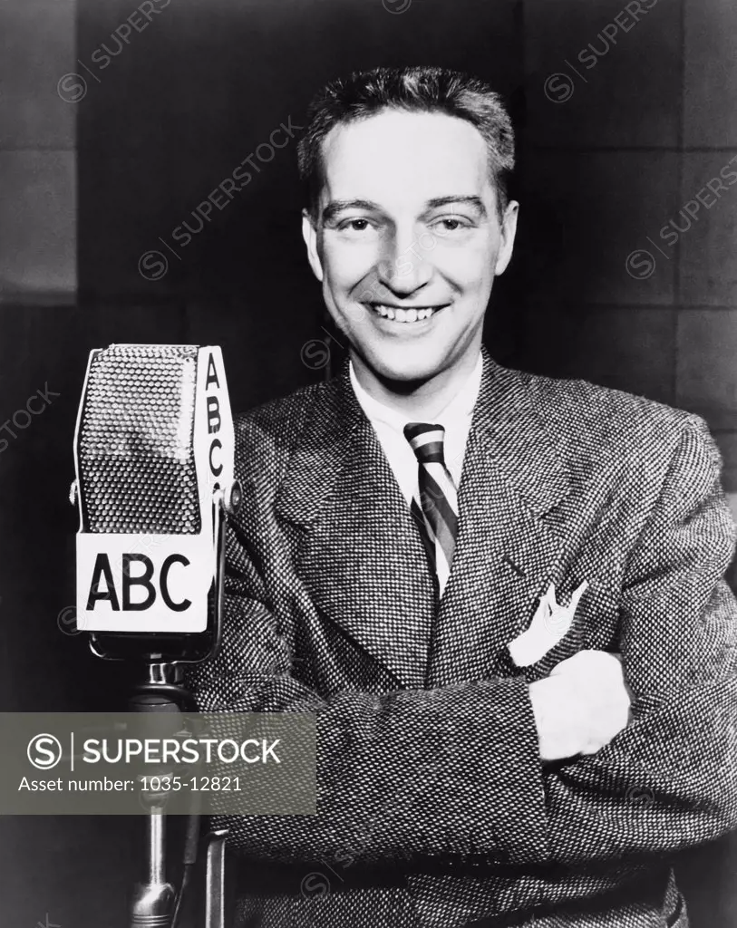 United States:   c. 1945 Radio host and personality Garry Moore in front of an ABC microphone.