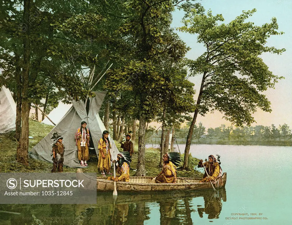 MInnesota, 1904 A photochrome of the Ojibwa hunters returning to their camp in their birchbark canoe.