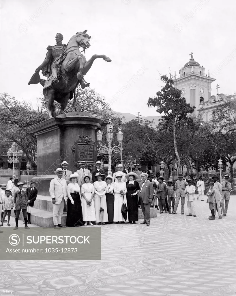 Caracas, Venezuela:  c.  1915 Tourists in front of the statue of Simon Bolivar in the Plaza of Caracas. Bolivar was the liberator of South America.