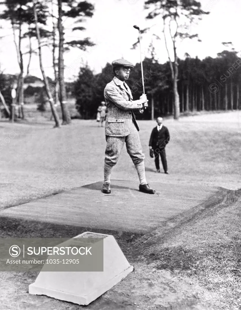 Tokyo, Japan:  August 16, 1926 Prince Hirohito watches his ball after his drive at the Tokyo Golf Club.