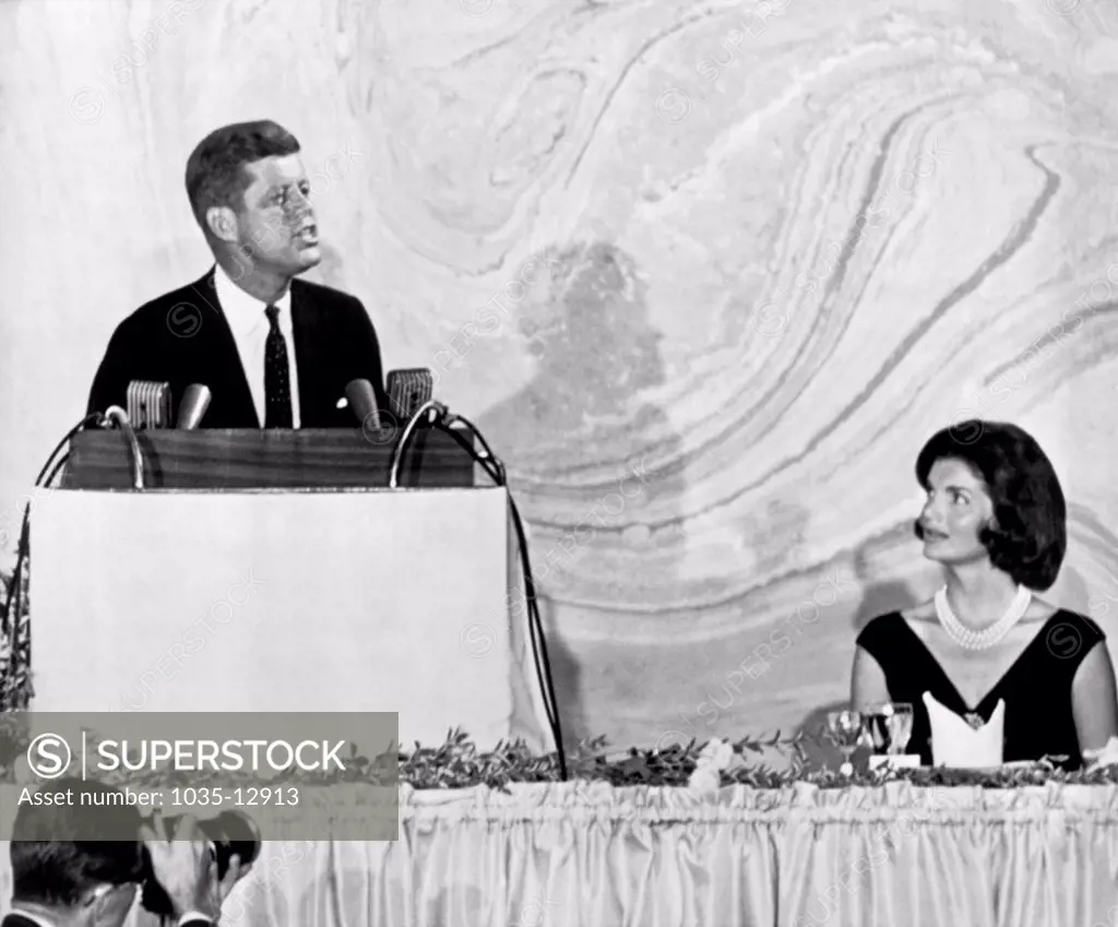 Washington, D.C.:  September 20, 1960 Senator John F. Kennedy as he spoke tonight at a $100-a-plate fund raising dinner. His wife, Jacqueline, watches the Democratic presidential nominee as he outlines his plan to preserve and further U.S. world leadership against the efforts of Communism. It was his first nationwide televised speech of the presidential campaign.