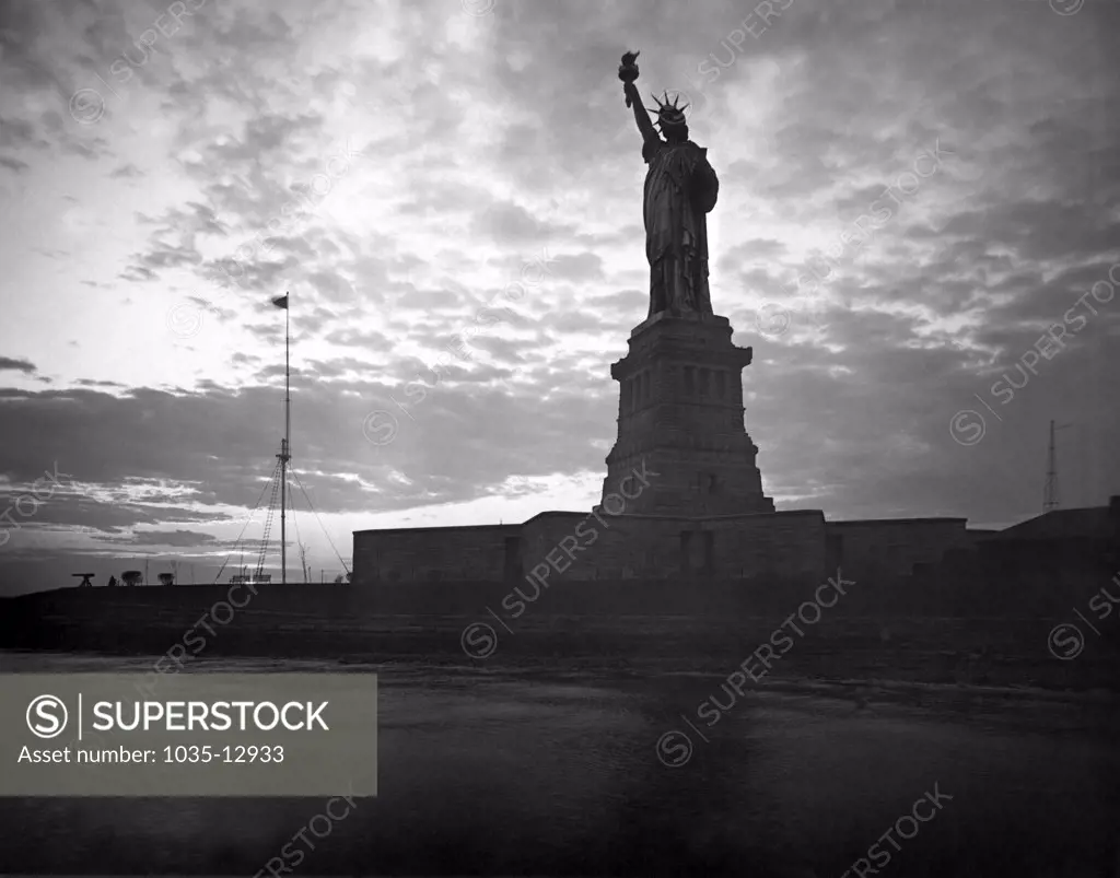 New York, New York:   1917 The Statue of Liberty at sunset.