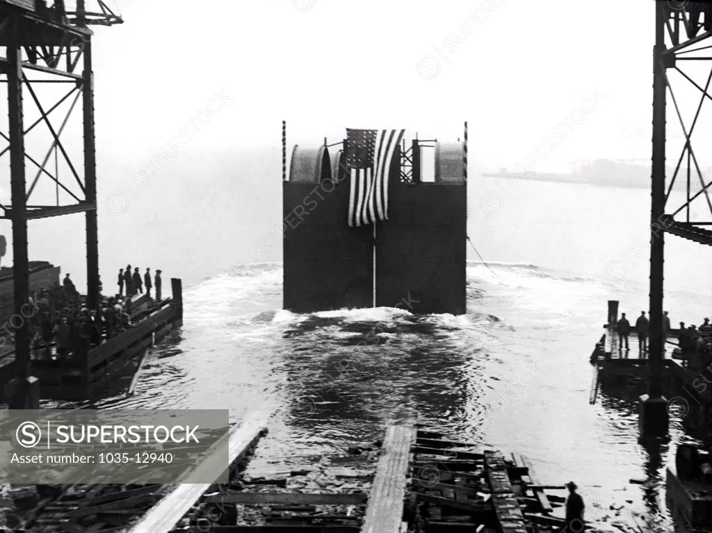 New York, New York: December 6, 1922 Launching the first steel caisson at the Staten Island shipyards  to be used in the in the excavating and lining under the Hudson River of the vehicular tube of the Holland Tunnel.