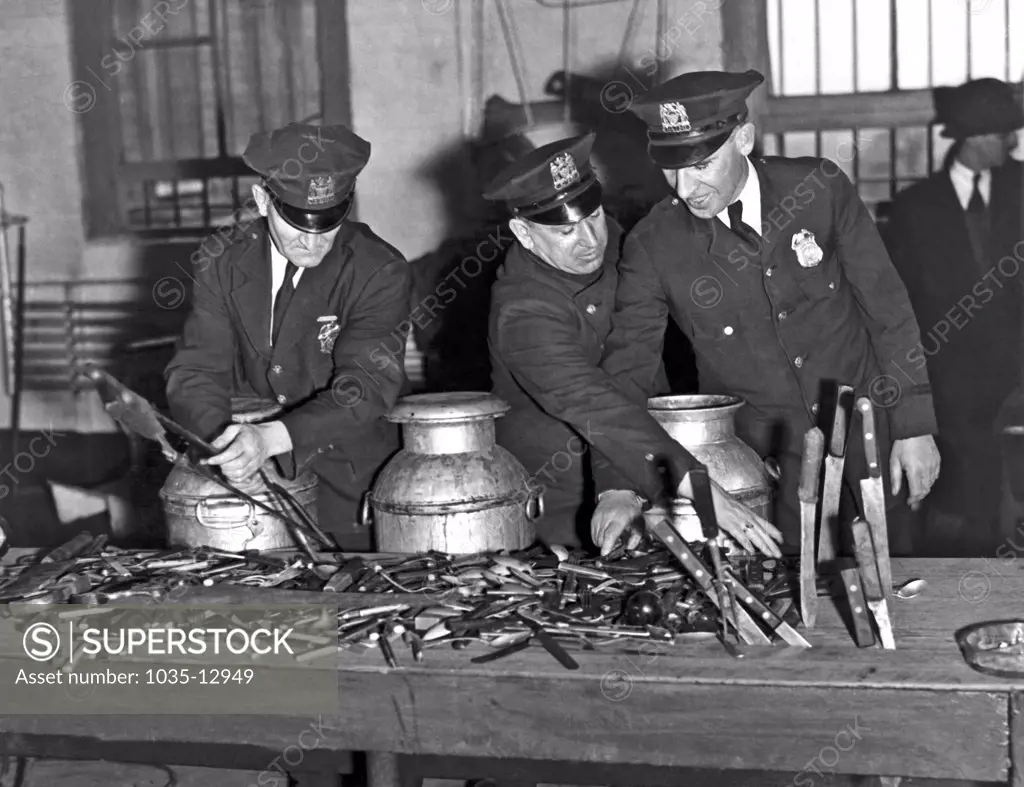 New York, New York:  c. 1934. Some of the contraband weapons taken from the cells of the prisoners on Welfare Island in a raid staged by Commissioner MacCormick.