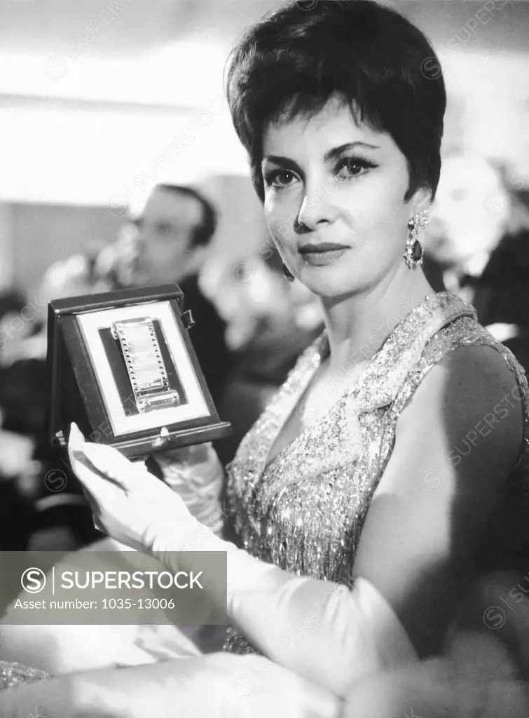 Rome, Italy:  March 30, 1963 Movie star Gina Lollobrigida holds her 'Silver Ribbon Award' which she received as best actress for 1962. It is Italy's equivalent to the Hollywood Oscar.