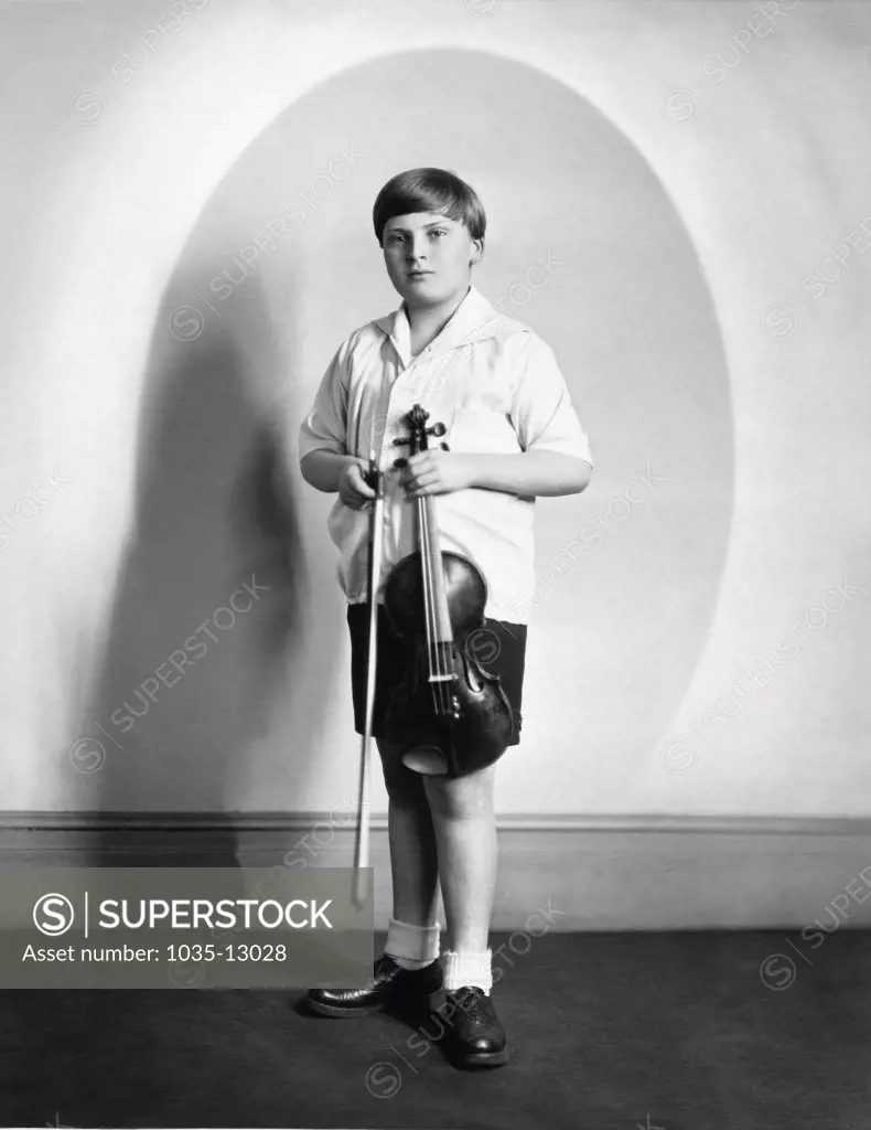 New York, New York:  c. 1931 A studio promotional photo of child prodigy violinist Yehudi Menuhin.