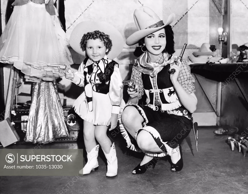 Oakland, California:   May 9, 1940 Four year old 'Baby Streamline' of the 1940 Golden Gate International Exposition and Ann Miller, dancing star of  George White's Scandals, team up for Oakland's Golden Forties Fiesta preceding the opening of the Exposition on Treasure Island.