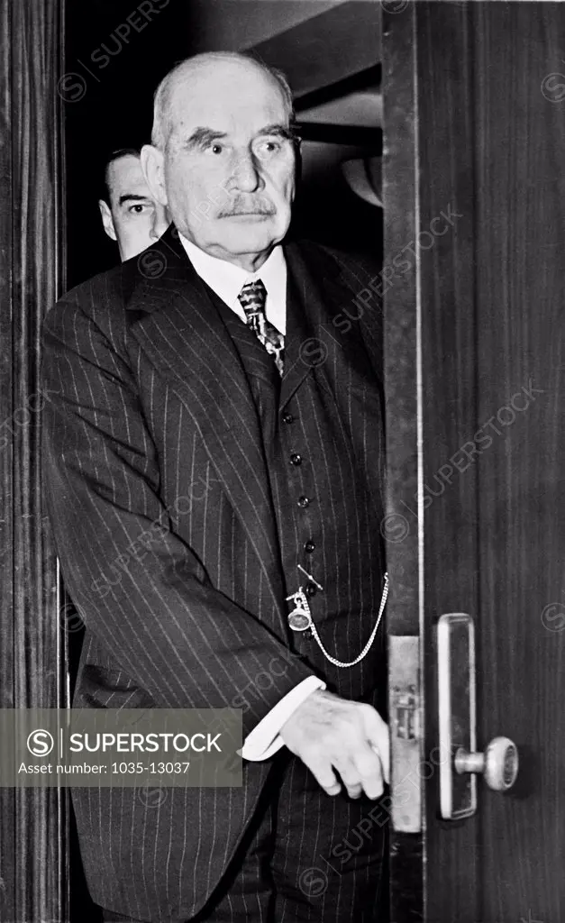 New York, New York:  May 3, 1938 Financier J.P. Morgan coming through the door to testify at the Federal Security and Exchange Commison hearing on the Richard Whitney case before them.