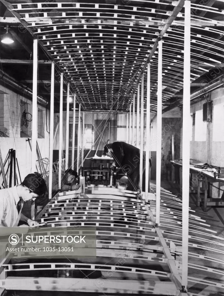 London Colney, England:  February 7, 1948 Workers at the de Havilland Aircraft plant construct a replica of the biplane in which Orville and Wilbur Wright made their historic flight at Kitty Hawk, North Carolina.
