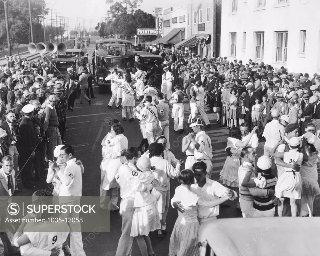 Culver City, California:  1928 The early stages of the marathon dancing endurance contest that started in Culver City and continued eight miles to Ocean Park in Santa Monica. The dancers were accompanied by five motor trucks laden with jazz bands.