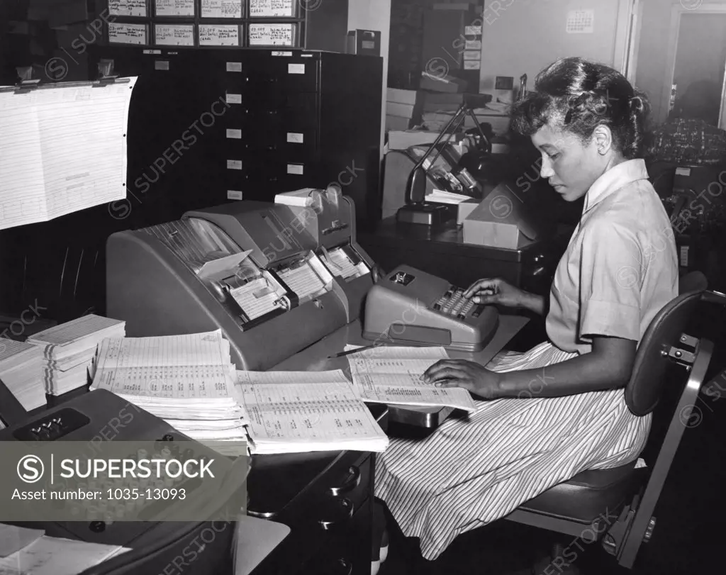 Washington, D.C.:  July, 1965 A young woman enters data for crop reports for the U.S. Department of Agriculture.