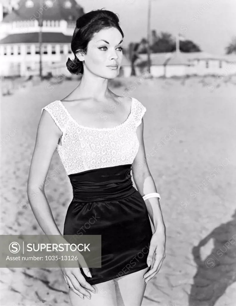 United States:  c. 1961 A fashion model wearing the 'La Reina' mini skirt and bodice by fashion designer Rose Marie Reid.