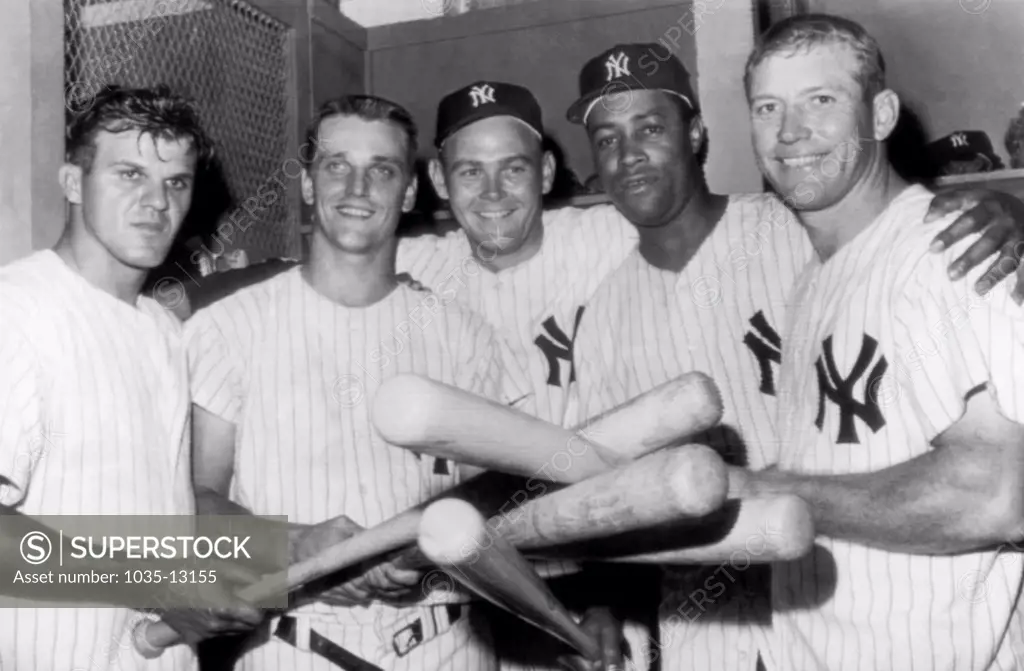 New York, New York:  July 3, 1961 New Yankee pitcher Bud Daley shows his appreciation for the linup that got him a 13-4 victory over the Washington Senators. L-R: Bill Skowron, Roger Maris, Daley, Elston Howard and Mickey Mantle. Skowron, Howard and Mantle each hit a home run in the game, with Maris hitting two.