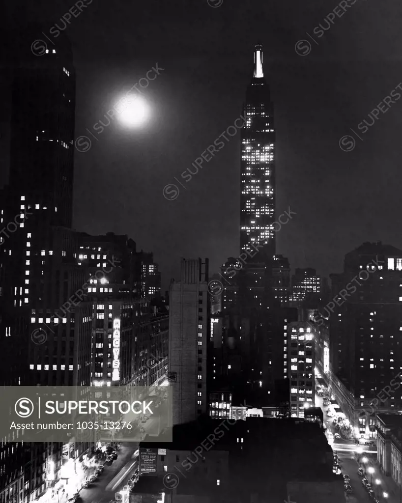 New York, New York:   October 20, 1945 The Empire State Building, the world's tallest building, competes with a full moon for primacy over the New York Skyline.