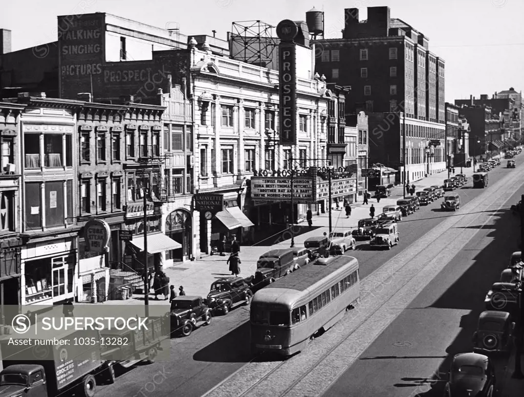 New York, New York:  1940 Looking east on 9th Street in Brooklyn with a streetcar running in front of the Prospect movie theater.
