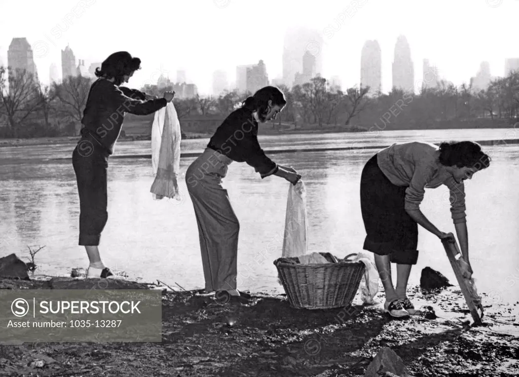 New York, New York:  1949 A water shortage in New York has these three young women washing their clothes at one of the lakes in Cantral Park.