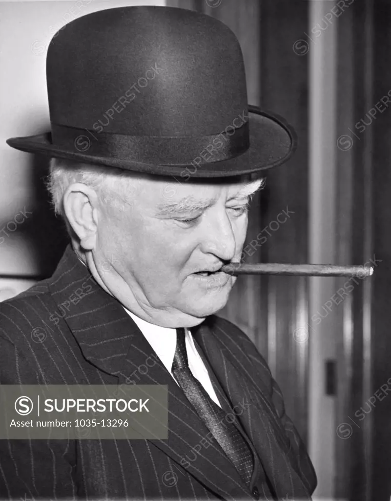 Washington, D.C.:  June 2, 1938 Vice President Jphn Nance Garner sports the new derby that was given to him by Rep. Phillips of Connecticutt. The cigar goes with Texas Jack's every day attire.