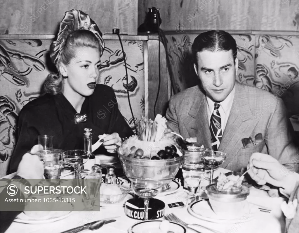 New York, New York:  November 14, 1941 Actress Lana Turner and orchestra leader Artie Shaw having dinner at the Stork Club. They are together for the first time since their divorce and are now planning their second marriage.