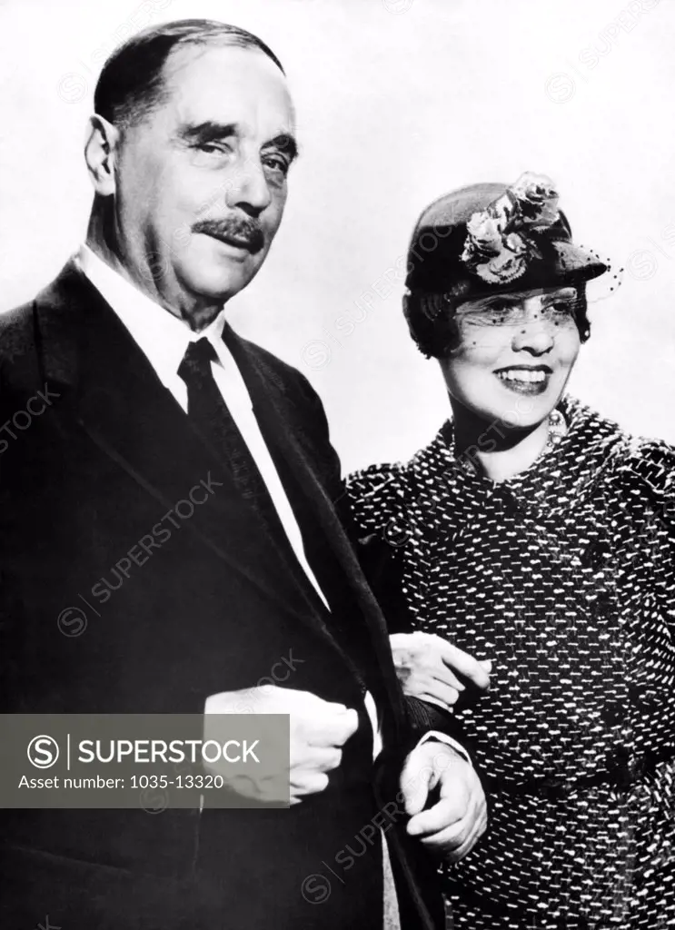 Hollywood, California:  December 4, 1935 Anita Loos, author of 'Gentlemen Prefer Blondes', escorts British writer H.G. Wells through the MGM studios in Hollywood.