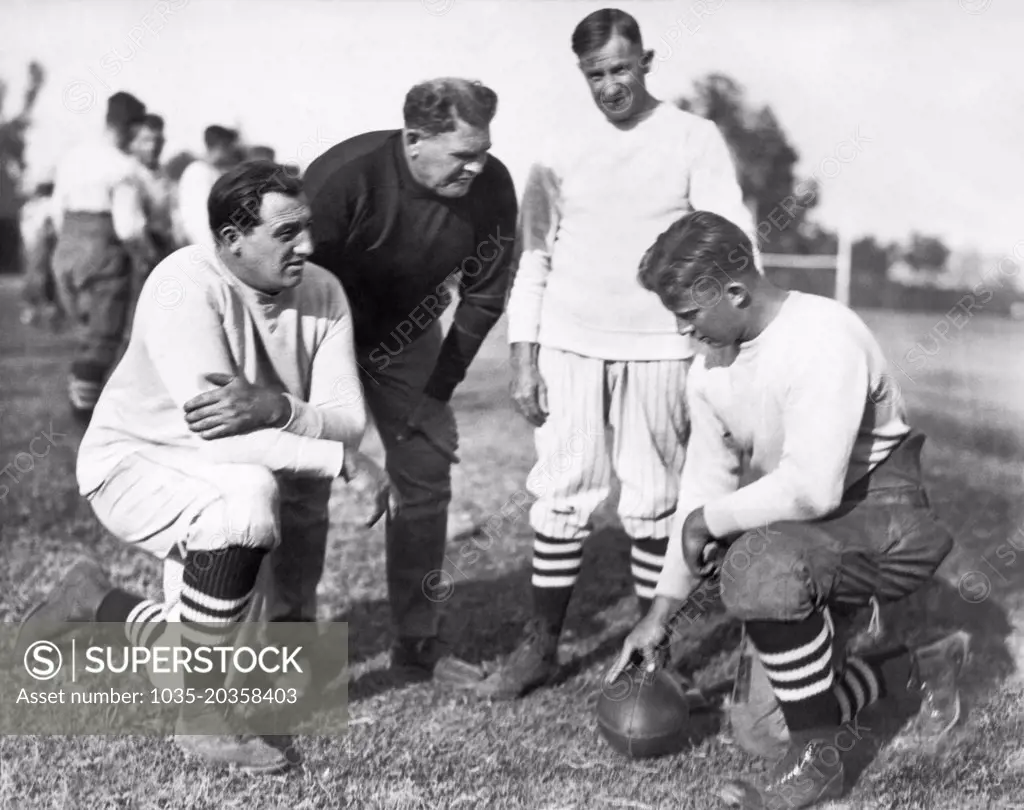 Stanford, California:  November, 1924 Glenn "Pop" Warner is the new football coach at Stanford University. L-R: "Tiny" Thornhill, linesmen tutor; Pop Warner; Andy Kerr, Warner's assistant; and team captain Jim Lawson.