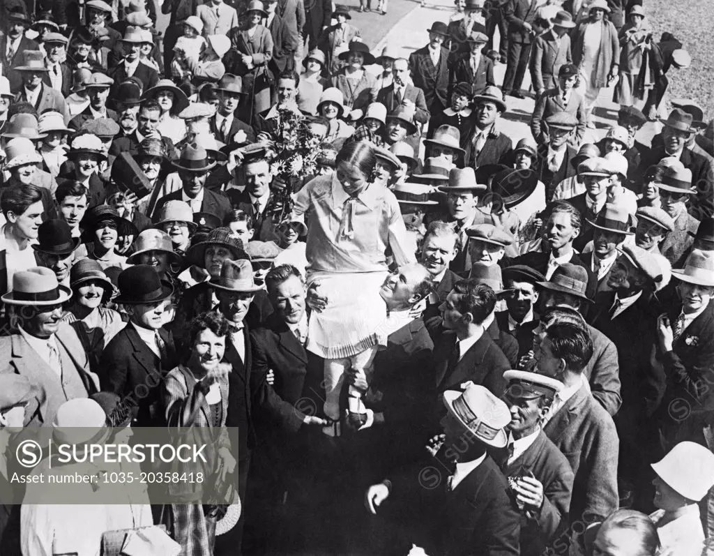 Dover, England:  September 6. 1926 Mrs. Clemington (Amelia) Corson being carried on the shoulders of her supporters after becoming the second woman to successfully swim across the English Channel.