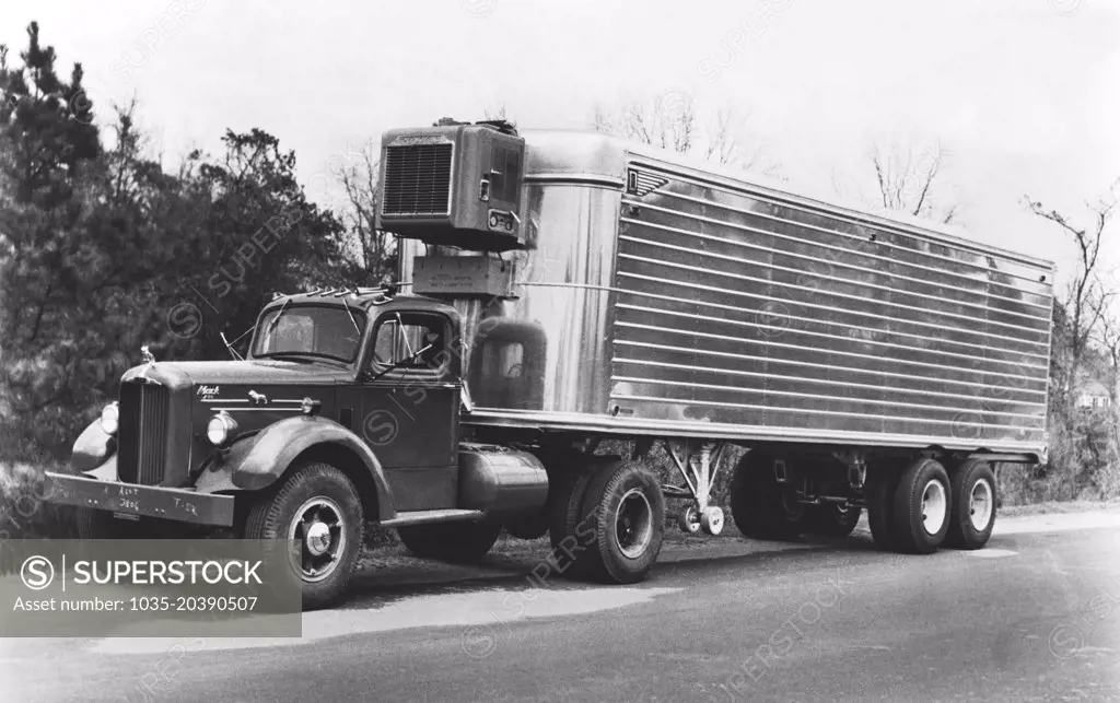 United States:  c. 1947 A Mack truck hauling a refrigerated semi trailer.