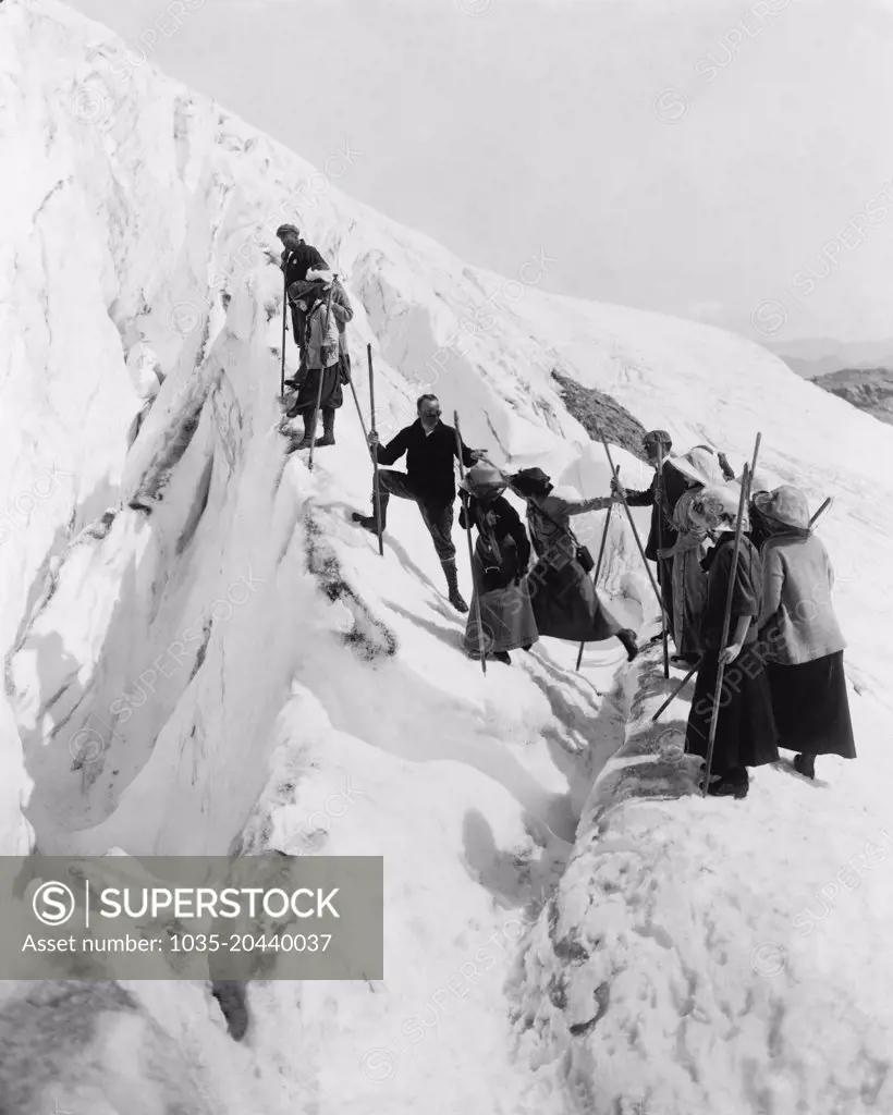 Rainier National Park, Washington:   c. 1915 A group of men and women climbing Paradise Glacier.