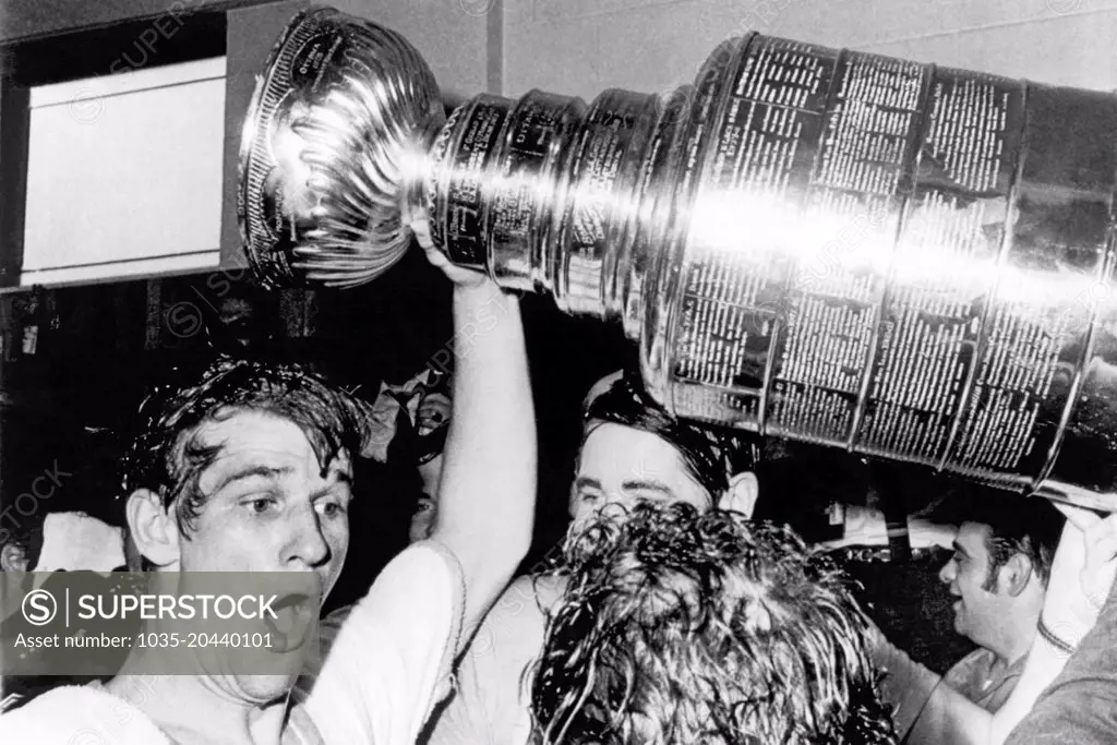Boston, Massachusetts:  May 10, 1970 Boston Bruins star Bobby Orr whoops and holds up the Stanley Cup after he scored the winning goal in overtime against the St. Louis Blues at the Boston Garden. Boston won the hockey playoff championship for the first time in 29 years.