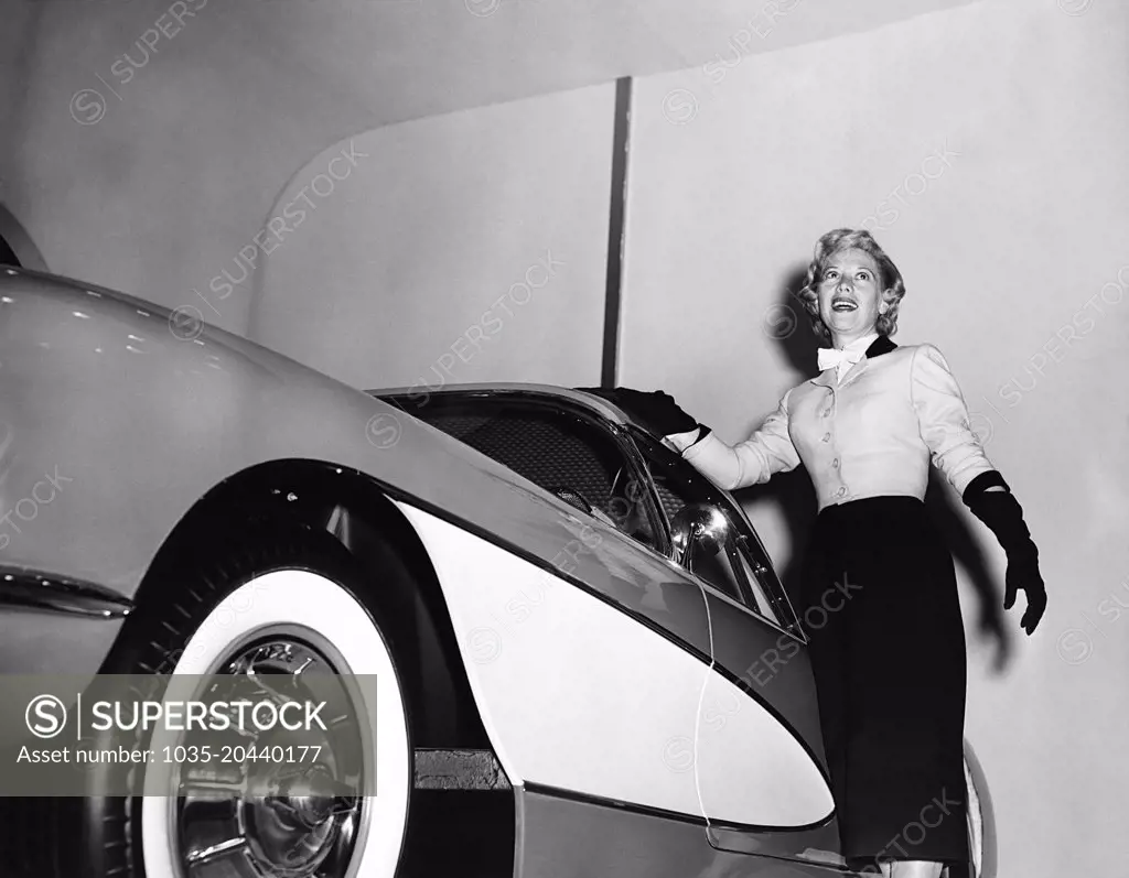 New York, New York:   January, 1956 Dinah Shore standing next to a 1956 Corvette at the General Motors Motorama Show. Chevrolet was the sponser of her TV show.