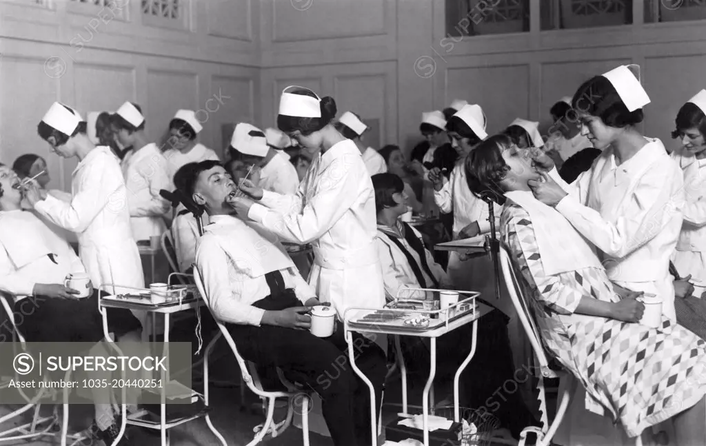 New York, New York:  c. 1926 The Dental Clinic of the Bowling Green Neighborhood Association is treating 1,500 school children of Public School #29 of Washington Street. The treatment is done by the girls of the School of Oral Hygiene of the Columbia University Dental College.