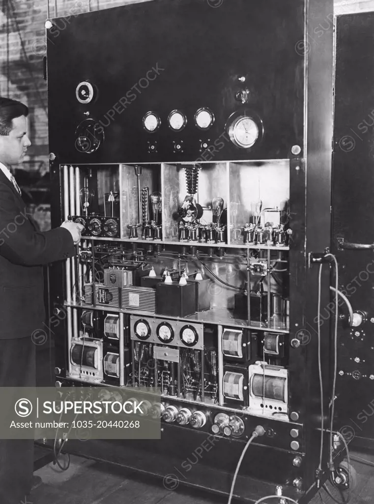 Chicago, Illinois:  1930 Television pioneer Ulises Sanabria at the control board his newly developed television transmitter.