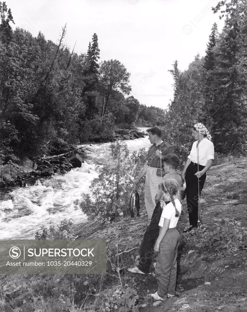 Oba, Ontario:  c.  1958 A vacationing family from New York with a catch of speckled trout from the stream.