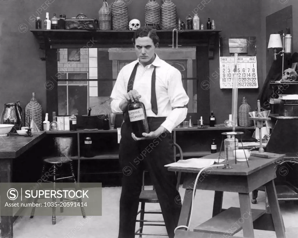 United States:  c.  1913 A scene from an early silent movie with an apparently mad scientist in his lab.